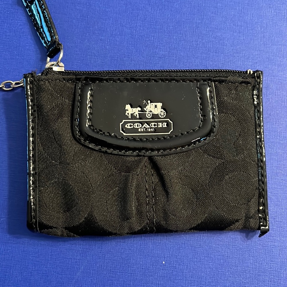 Coach coin wallet in black. Excellent condition barely used.